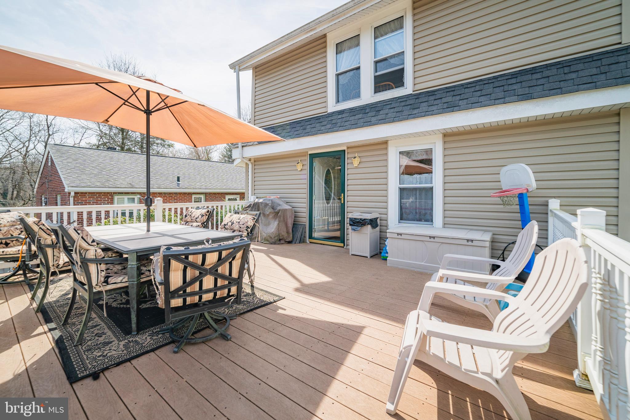 7 Chestnut Parkway Wallingford, PA 19086 - Photo 14 of 50 a view of a patio with table and chairs with wooden floor and fence