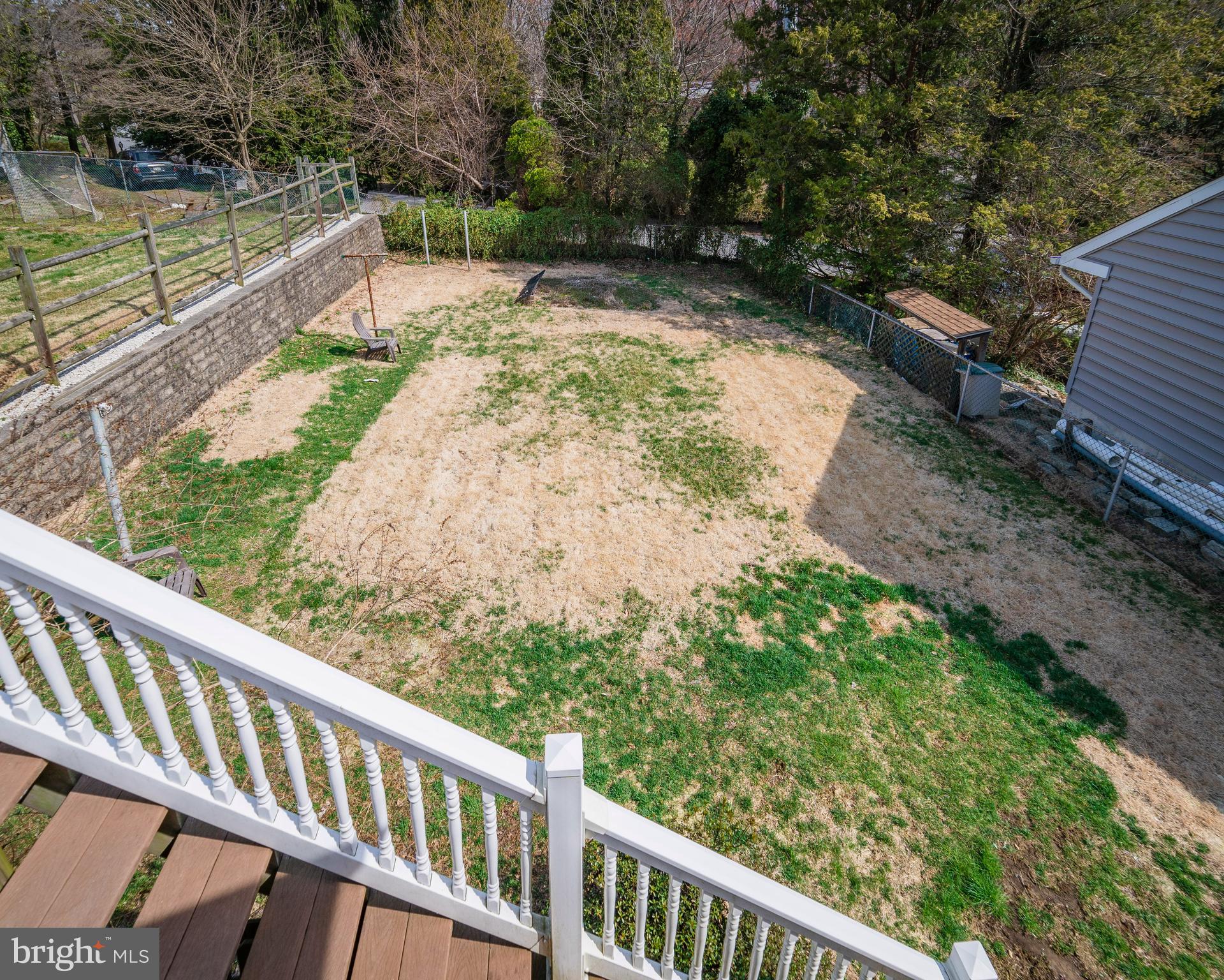 7 Chestnut Parkway Wallingford, PA 19086 - Photo 16 of 50 a view of a wooden deck with a forest