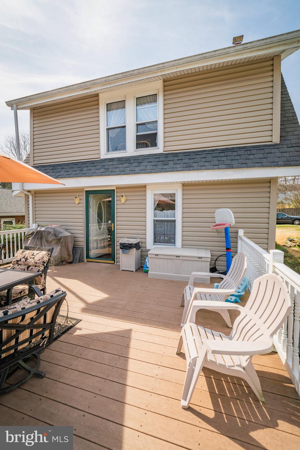 7 Chestnut Parkway Wallingford, PA 19086 - Photo 20 of 50 a view of a patio with dining table and chairs with wooden floor