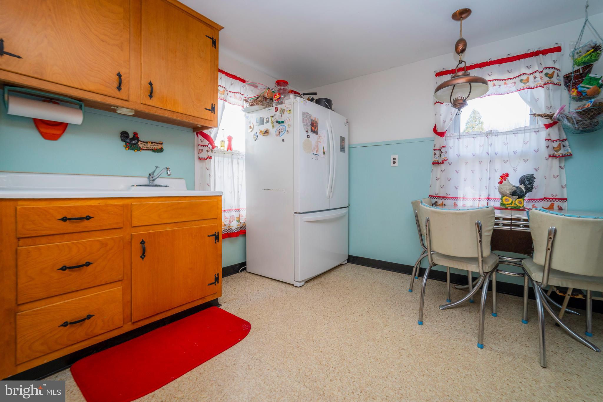 7 Chestnut Parkway Wallingford, PA 19086 - Photo 45 of 50 a kitchen with refrigerator and cabinets