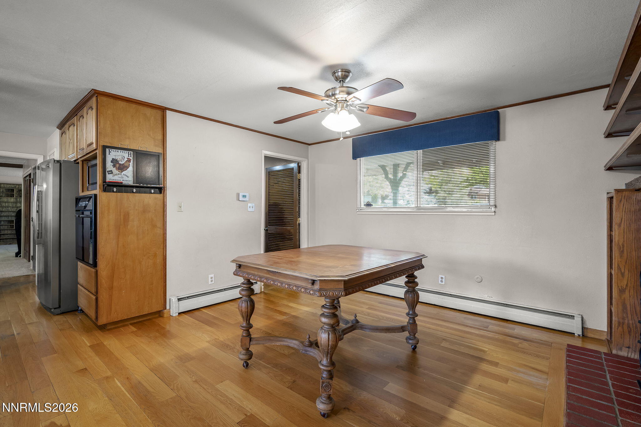549 Ruby Lane Carson City, NV 89706 - Photo 10 of 37 a room with chandelier fan and wooden floor