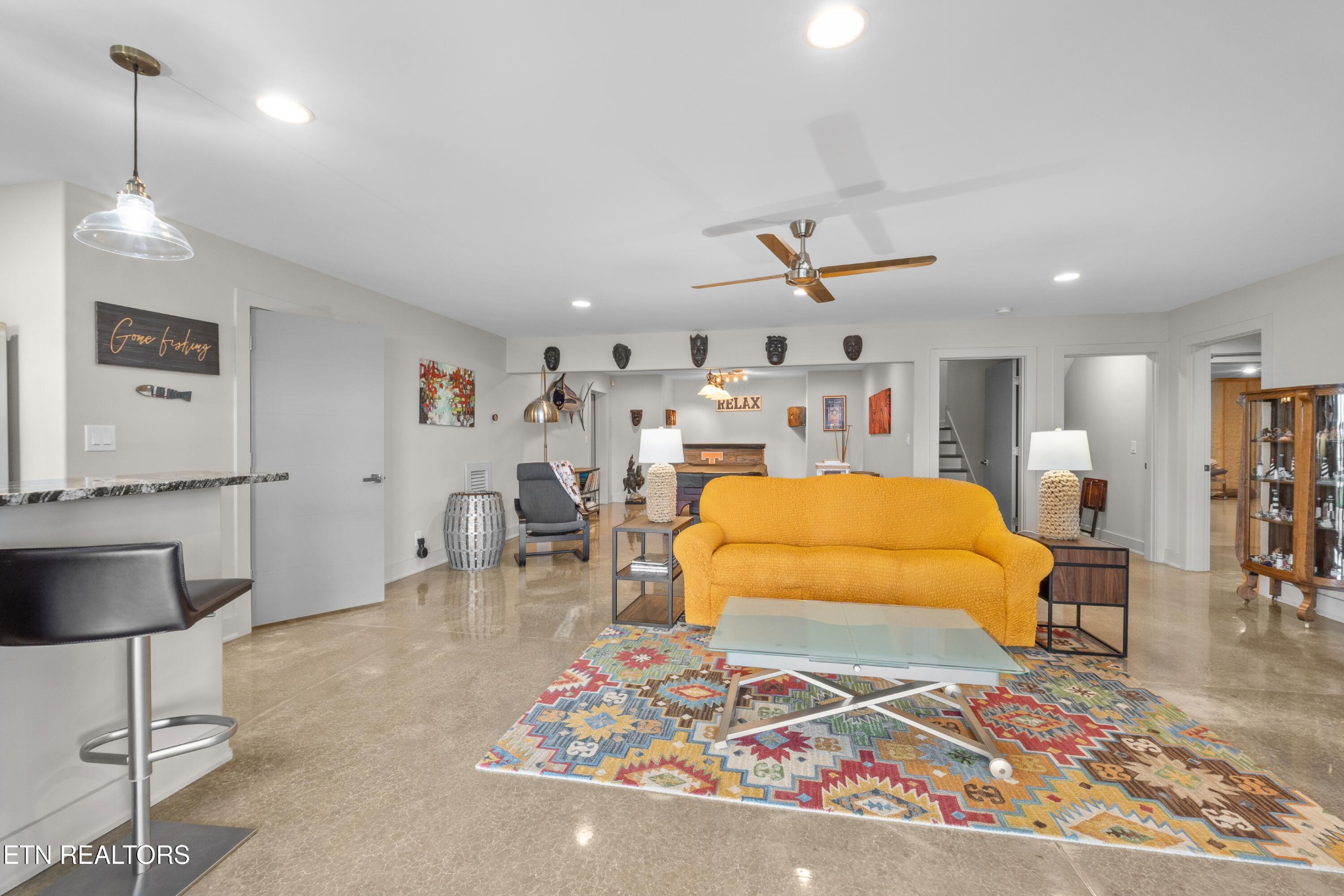 3702 Promontory Point Louisville, TN 37777 - Photo 39 of 60 a living room with furniture a rug and a chandelier