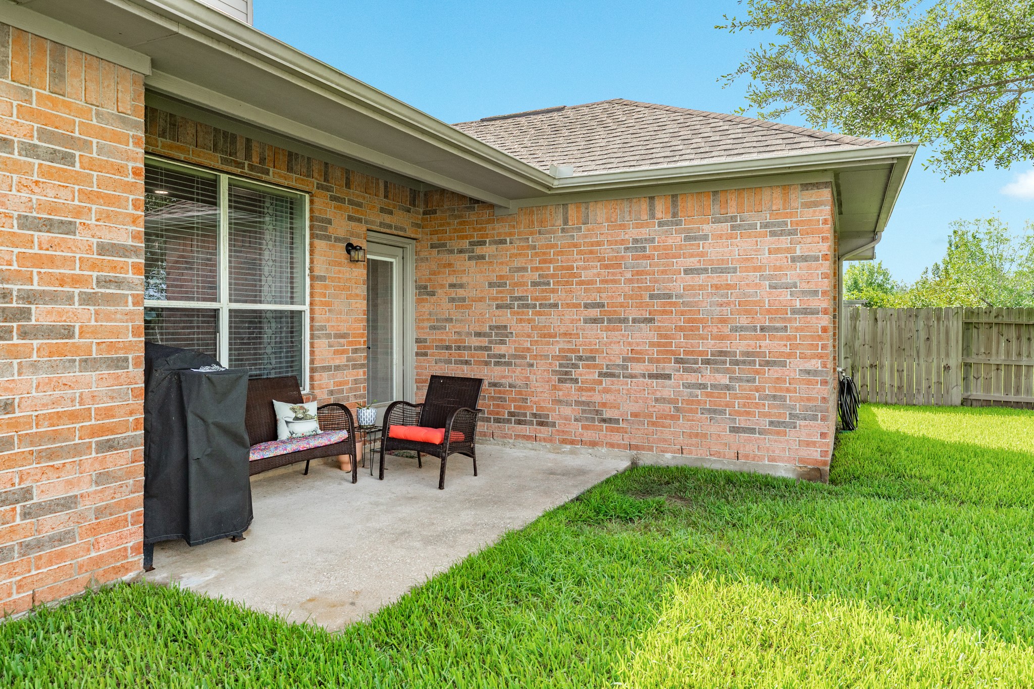 13808 Stark Bridge Lane Rosharon, TX 77583 - Photo 26 of 39 Covered patio overlooking the spacious backyard featuring mature, sprawling shade trees.