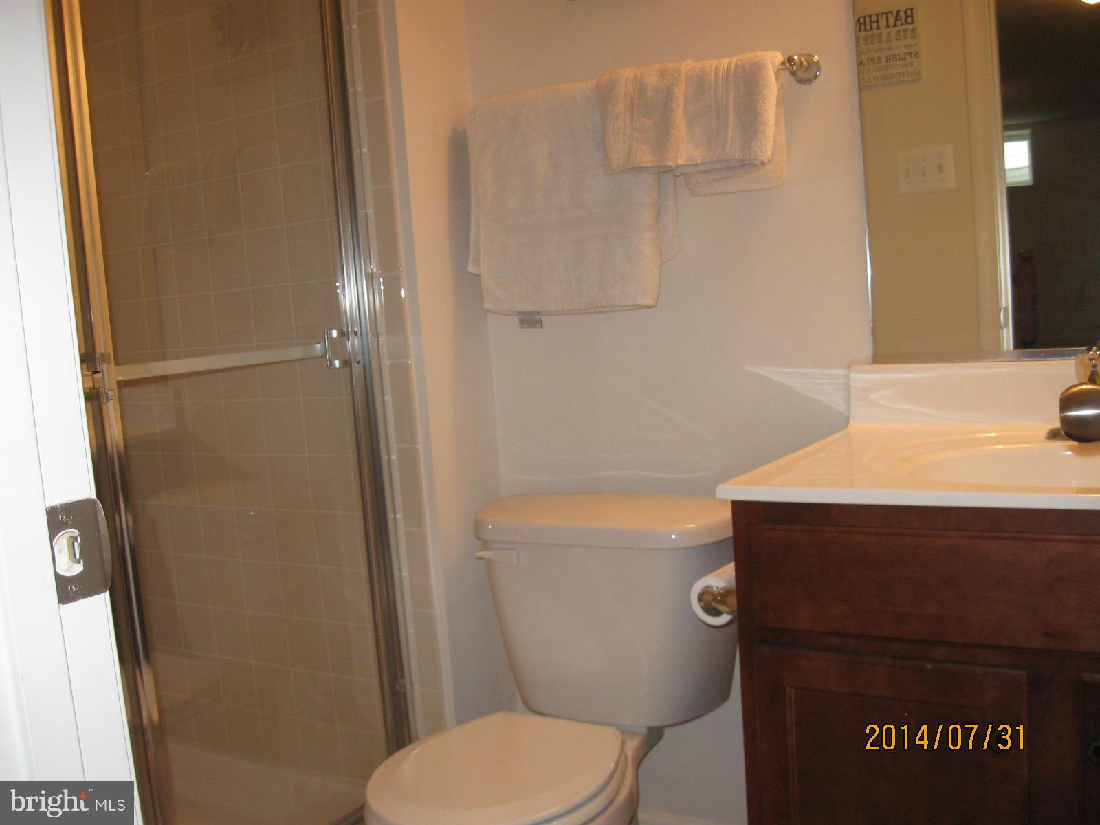 1722 Fletchers Drive Point of Rocks, MD 21777 - Photo 14 of 30 a bathroom with a granite countertop sink toilet and shower