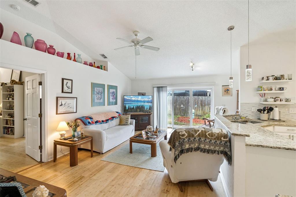 109 Hunter Point Court DeBary, FL 32713 - Photo 11 of 29 a living room with furniture and a table