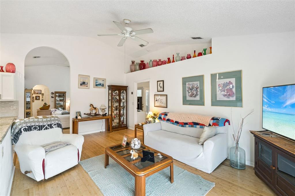 109 Hunter Point Court DeBary, FL 32713 - Photo 12 of 29 a living room with furniture or couch and a dining table