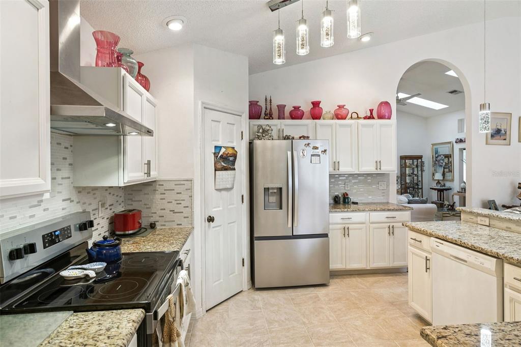 109 Hunter Point Court DeBary, FL 32713 - Photo 14 of 29 a kitchen with a sink stove and refrigerator