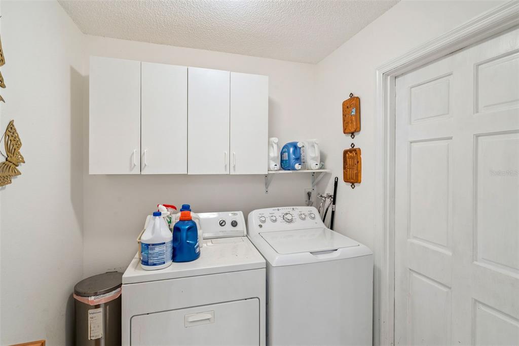109 Hunter Point Court DeBary, FL 32713 - Photo 23 of 29 a view of storage and utility room with washer and dryer