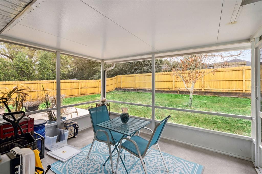 109 Hunter Point Court DeBary, FL 32713 - Photo 25 of 29 a view of a city from a dining room with large windows