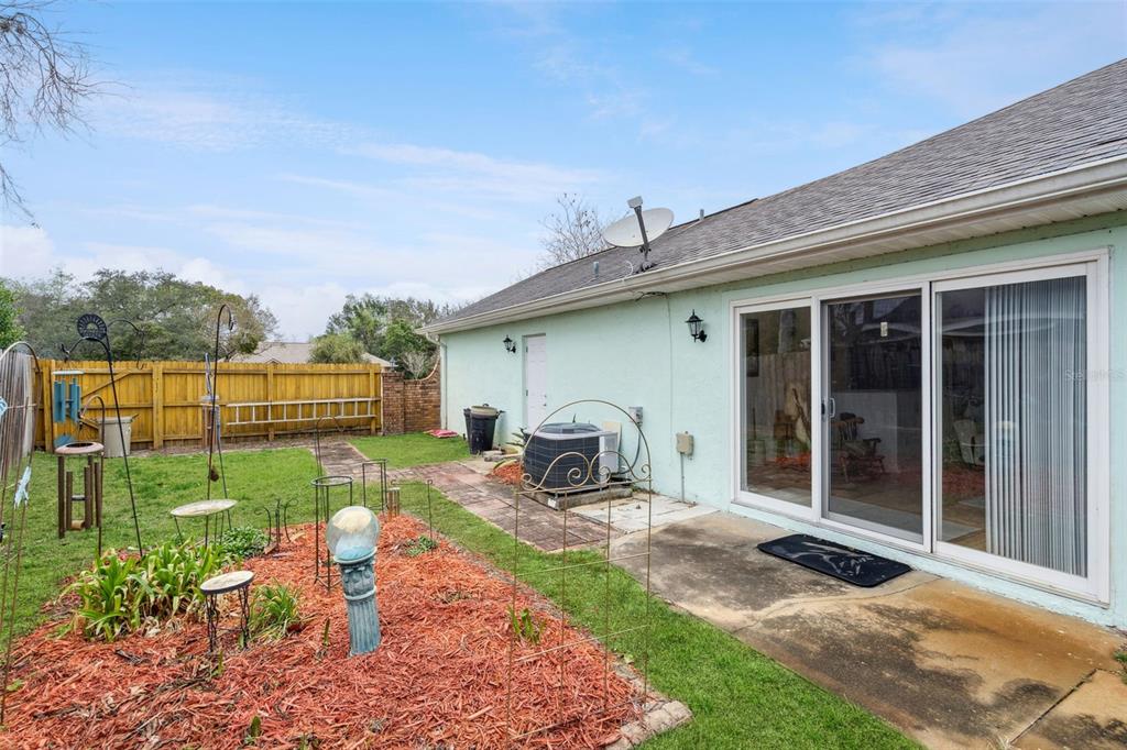 109 Hunter Point Court DeBary, FL 32713 - Photo 26 of 29 a front view of a house with garden