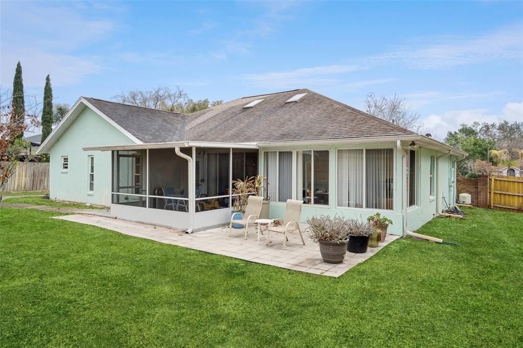 109 Hunter Point Court DeBary, FL 32713 - Photo 28 of 29 a view of a house with backyard porch and garden