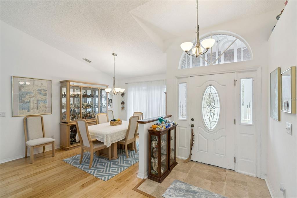 109 Hunter Point Court DeBary, FL 32713 - Photo 5 of 29 a view of a dining room with furniture window and wooden floor
