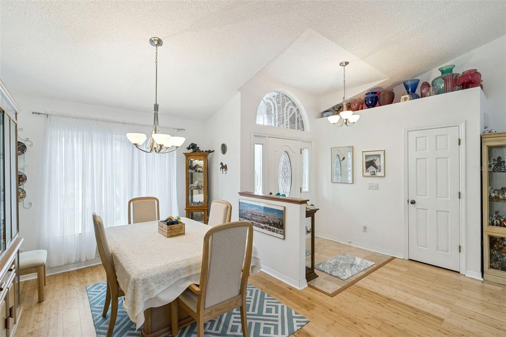 109 Hunter Point Court DeBary, FL 32713 - Photo 6 of 29 a view of a dining room with furniture window and wooden floor
