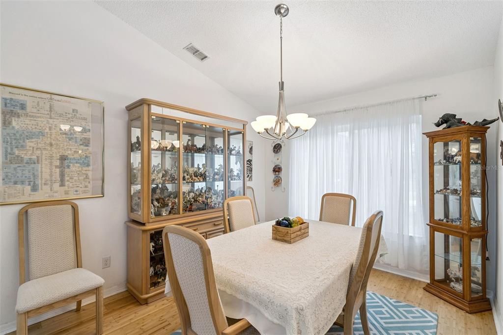 109 Hunter Point Court DeBary, FL 32713 - Photo 7 of 29 a view of a dining room with furniture window and wooden floor