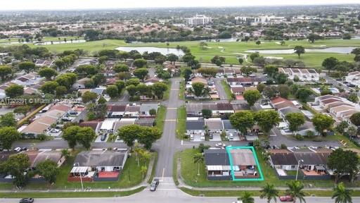 14025 Southwest 56th Terrace Miami, FL 33183 - Photo 4 of 8 an aerial view of residential houses with outdoor space and lake view