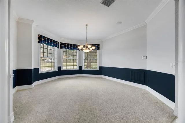 a kitchen with granite countertop a sink and a stove