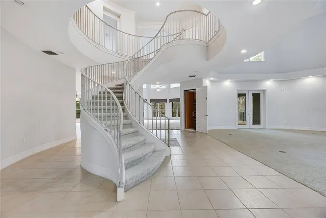a view of a swimming pool with a patio and a yard