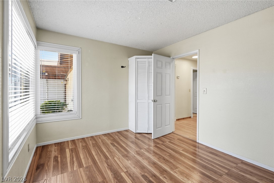 3971 Spring Leaf Drive Las Vegas, NV 89147 - Photo 31 of 48 The wood-style laminate flooring and ample window light define this versatile room.