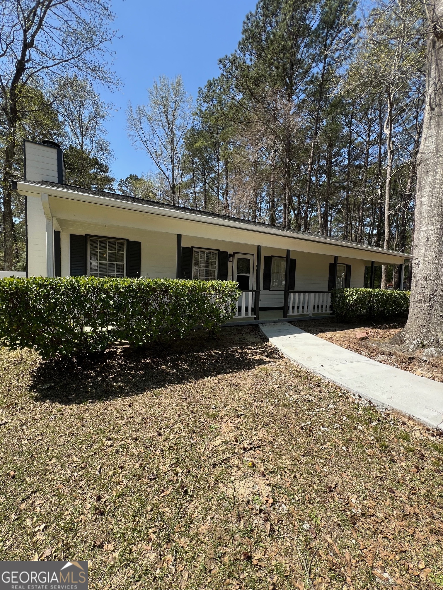 493 Table Mountain Drive Macon, GA 31220 - Photo 1 of 1 a front view of a house with yard and green space