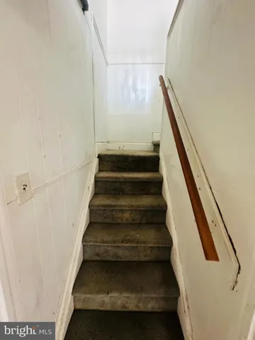 a view of kitchen and an empty room