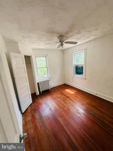 a view of staircase with white walls and a window