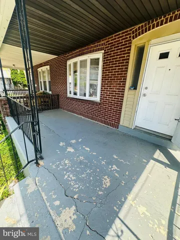 a view of a porch with wooden floor