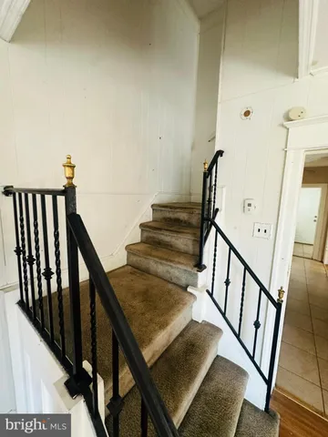a kitchen with a refrigerator a stove top oven a sink and dishwasher