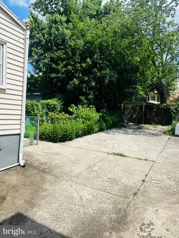 a view of backyard and garden