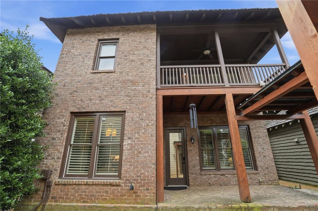 6645 Will Allen Road Cumming, GA 30040 - Photo 39 of 62 a view of a brick house with many windows