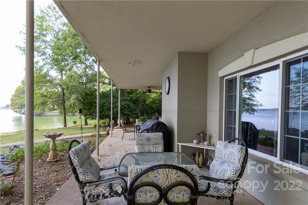 5985 Johnson Road Clover, SC 29710 - Photo 8 of 33 a view of a patio with a dining table and chairs