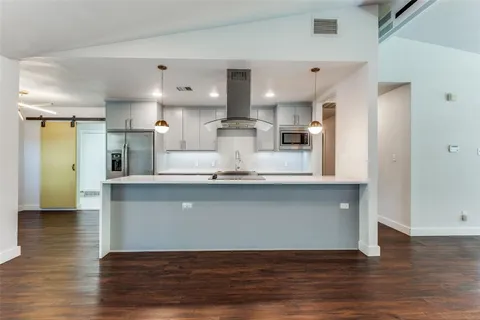a view of kitchen with wooden floor
