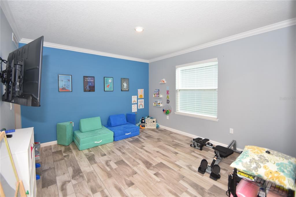 124 Oakleaf Way Palm Coast, FL 32137 - Photo 17 of 36 a bedroom with bed and a window