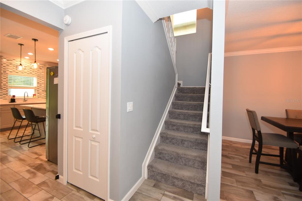 124 Oakleaf Way Palm Coast, FL 32137 - Photo 18 of 36 a view of a hallway with dining area and glass door
