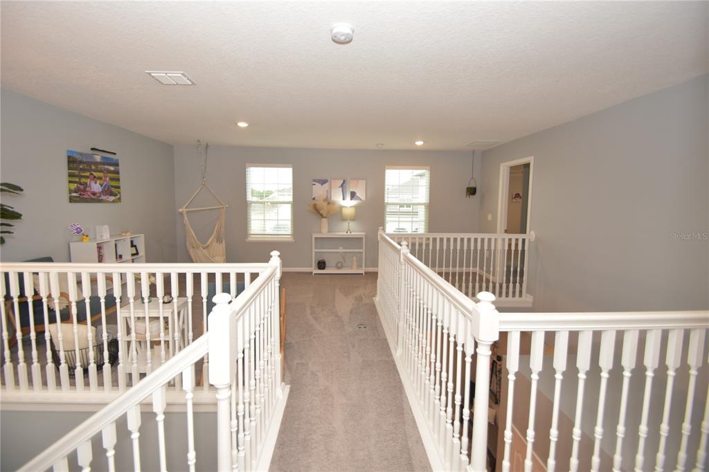 124 Oakleaf Way Palm Coast, FL 32137 - Photo 19 of 36 a view of staircase with wooden floor