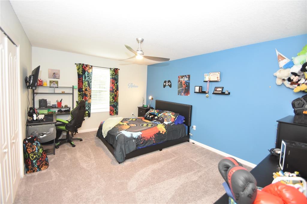 124 Oakleaf Way Palm Coast, FL 32137 - Photo 22 of 36 a bedroom with bed and a window