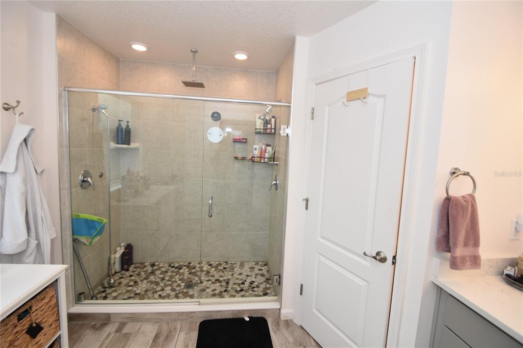 124 Oakleaf Way Palm Coast, FL 32137 - Photo 27 of 36 a bathroom with a shower and a sink