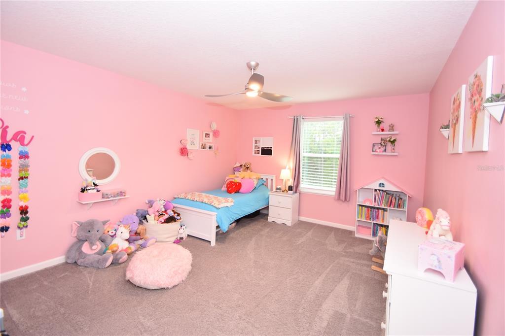 124 Oakleaf Way Palm Coast, FL 32137 - Photo 32 of 36 a bedroom with furniture and a window