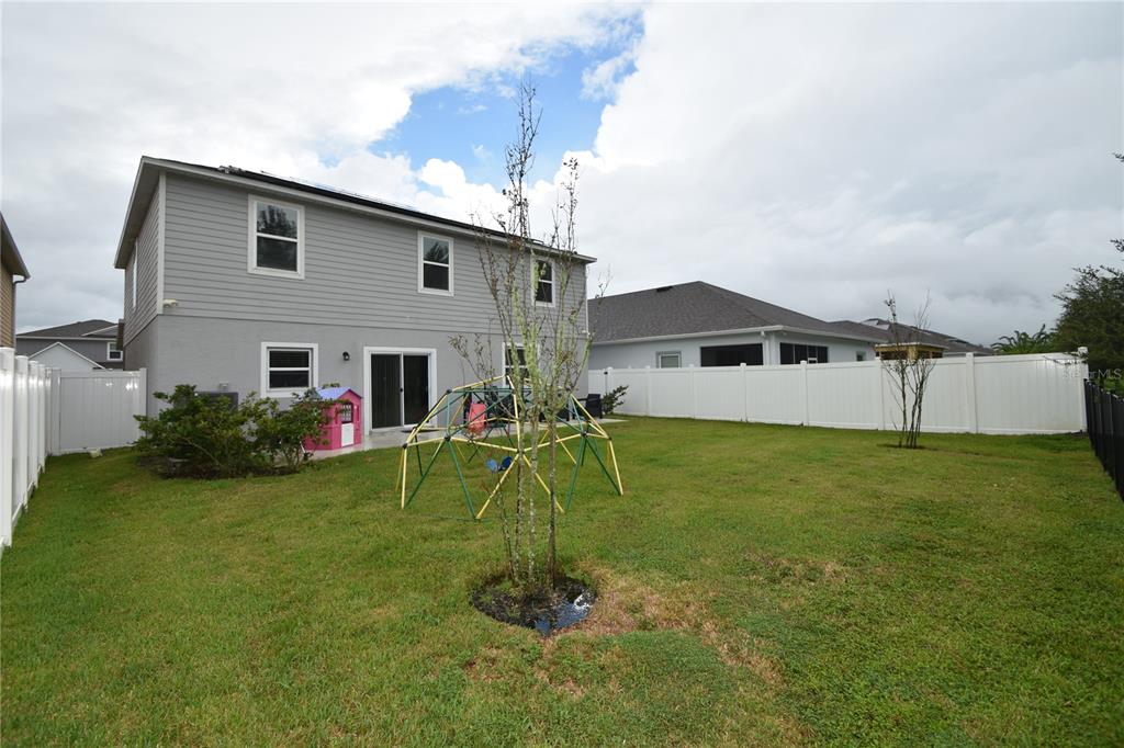 124 Oakleaf Way Palm Coast, FL 32137 - Photo 36 of 36 a house view with a play ground in front of it