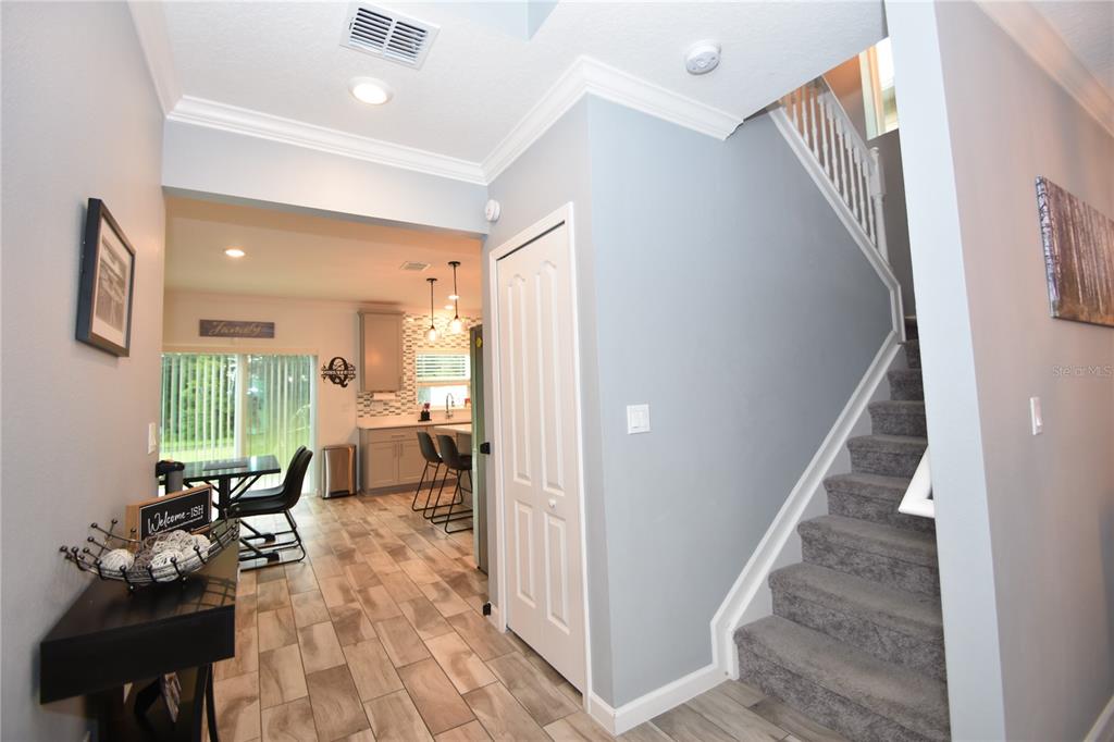 124 Oakleaf Way Palm Coast, FL 32137 - Photo 6 of 36 a living room with furniture and wooden floor