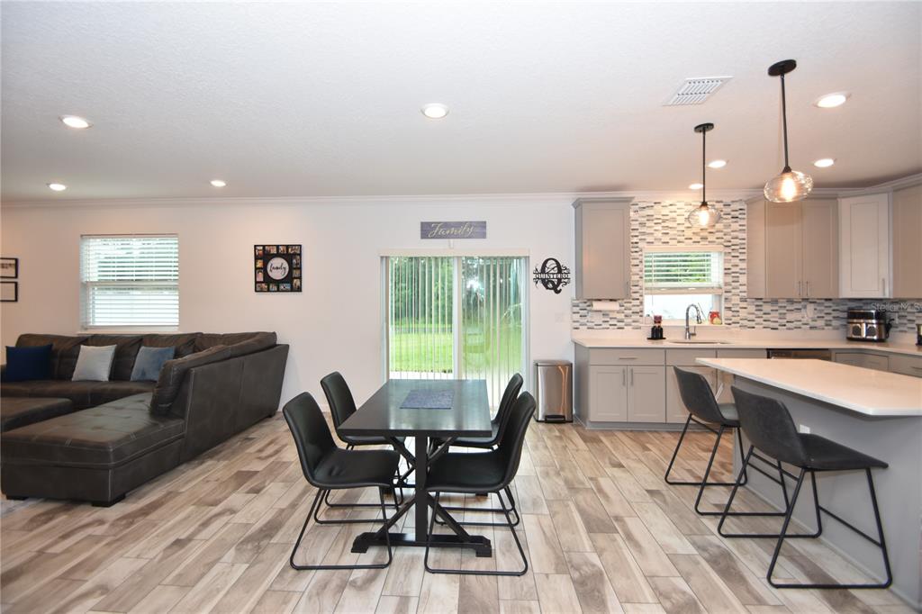 124 Oakleaf Way Palm Coast, FL 32137 - Photo 7 of 36 a view of a dining room with furniture window and outside view