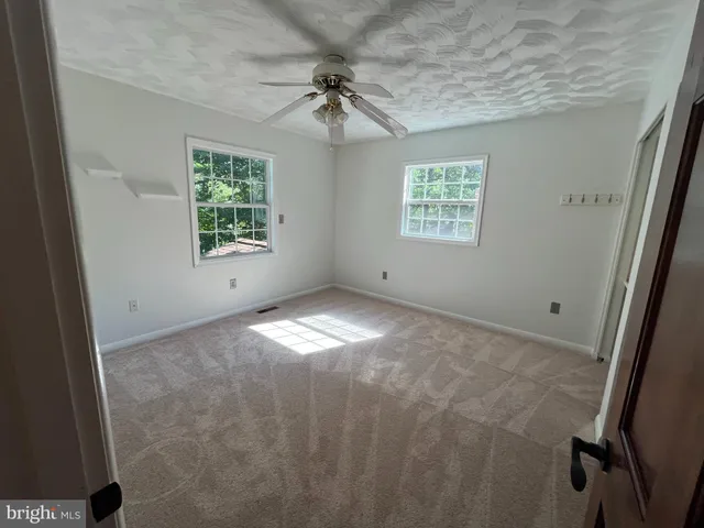 a kitchen with a sink and a stove top oven
