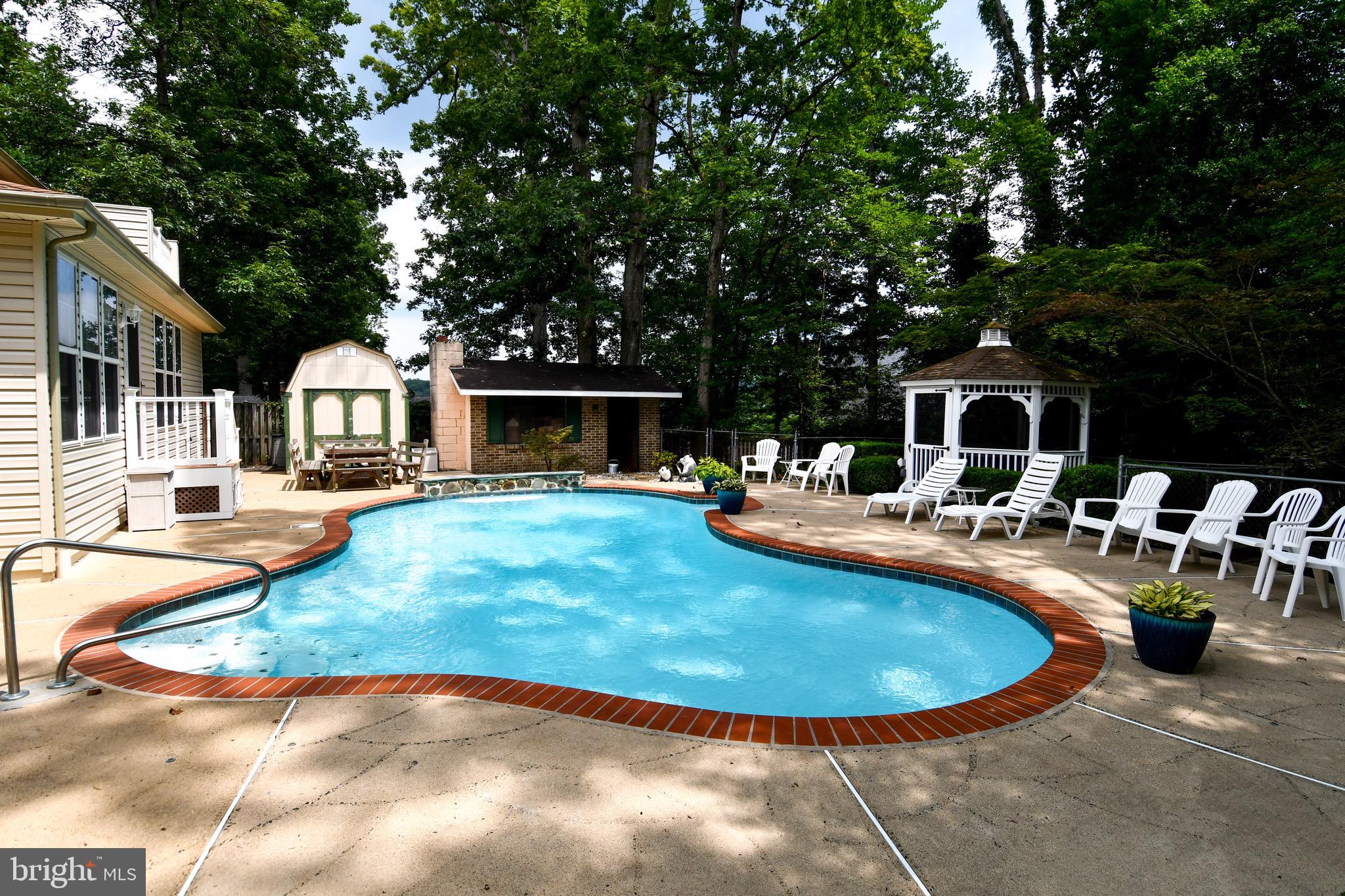 3203 Riverview Drive Triangle, VA 22172 - Photo 68 of 78 a view of a house with swimming pool and sitting area