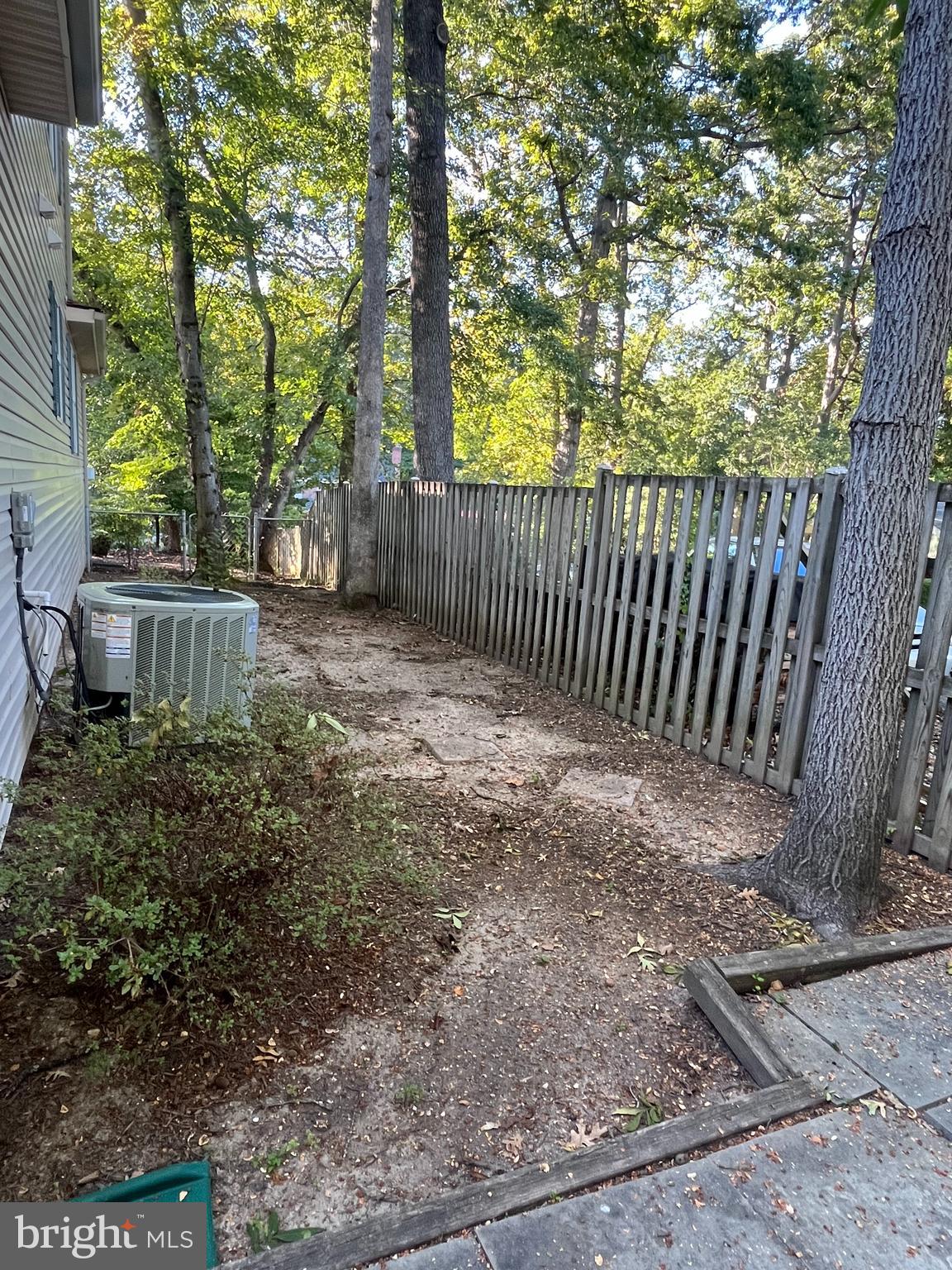 3203 Riverview Drive Triangle, VA 22172 - Photo 76 of 78 a view of a yard with plants and a bench