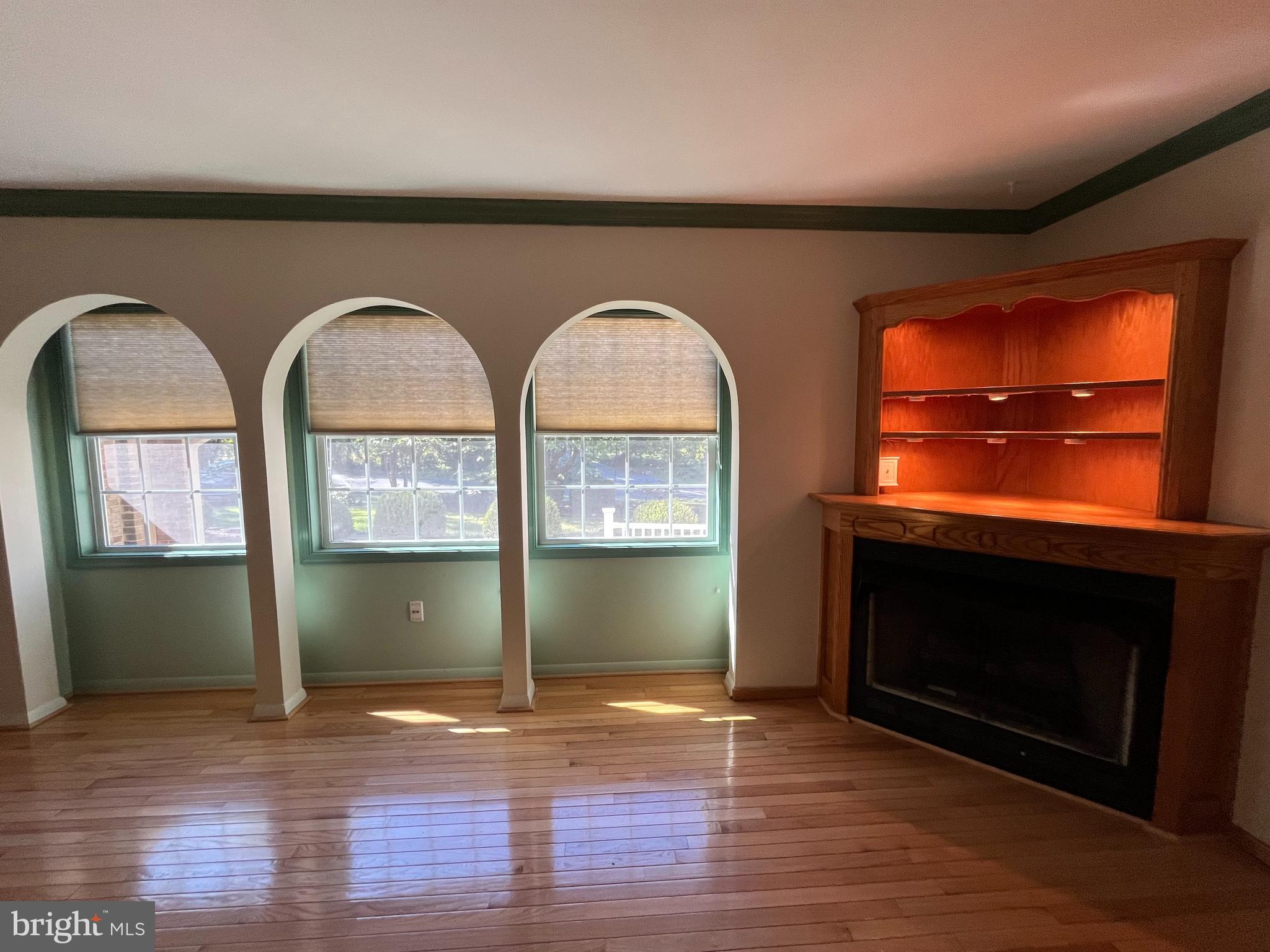 3203 Riverview Drive Triangle, VA 22172 - Photo 8 of 78 a view of an empty room with wooden floor and a fireplace
