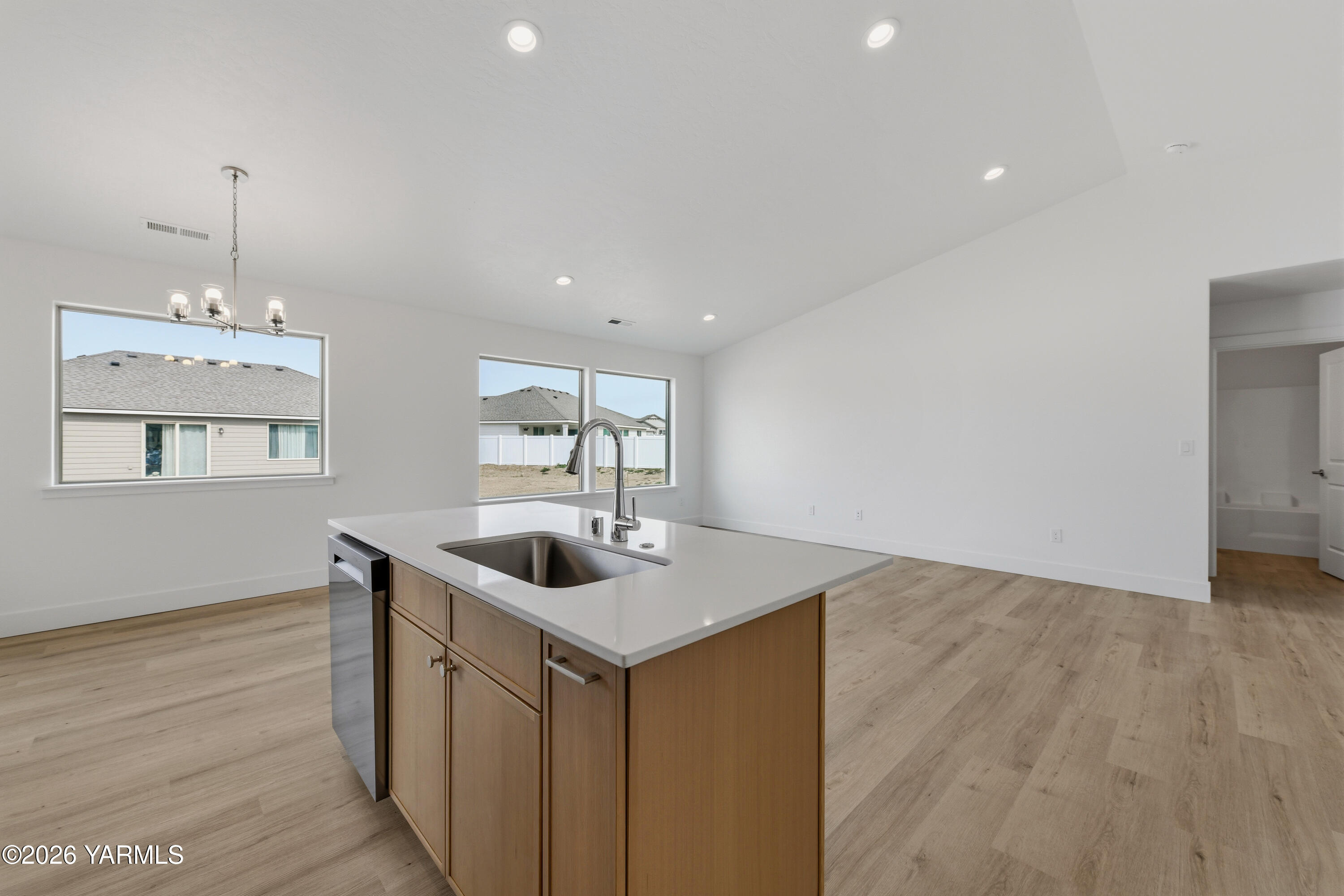 606 Grapevine Street, Unit PHASE 3 LOT 8) SPEC Grandview, WA 98930 - Photo 15 of 28 a kitchen with a sink and chandelier