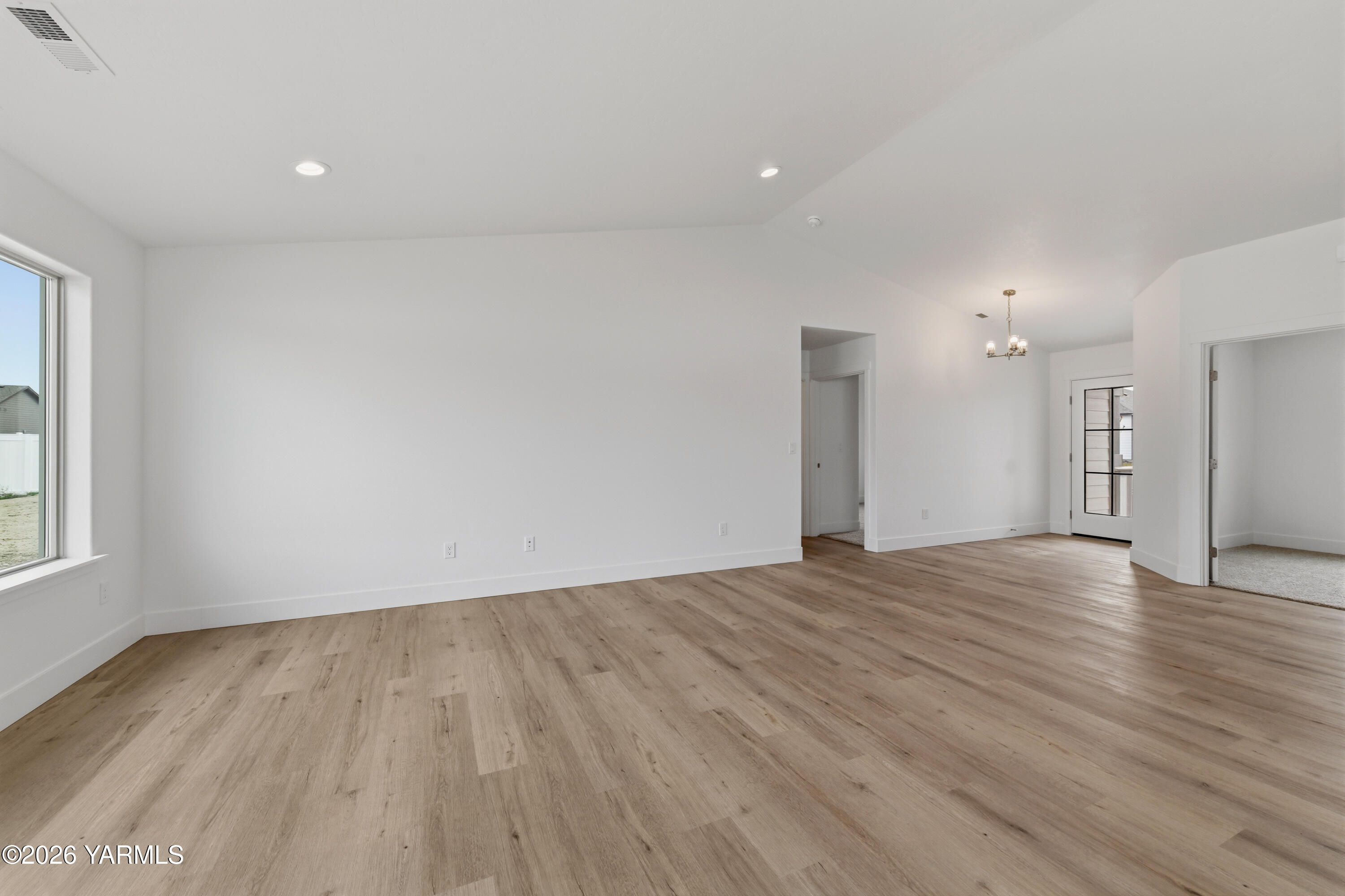 606 Grapevine Street, Unit PHASE 3 LOT 8) SPEC Grandview, WA 98930 - Photo 18 of 28 a view of empty room with wooden floor and fan