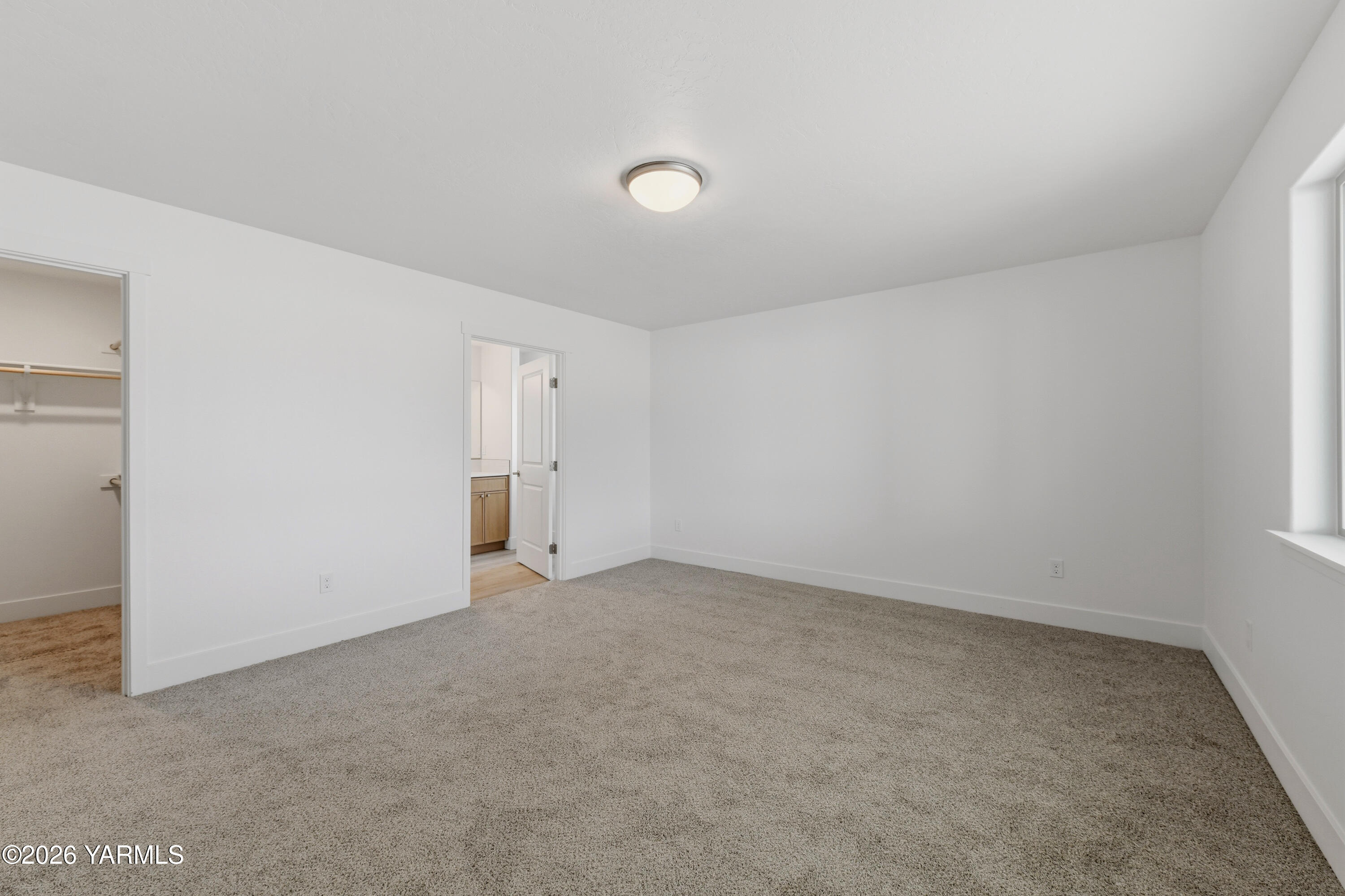 606 Grapevine Street, Unit PHASE 3 LOT 8) SPEC Grandview, WA 98930 - Photo 19 of 28 an empty room with an entryway