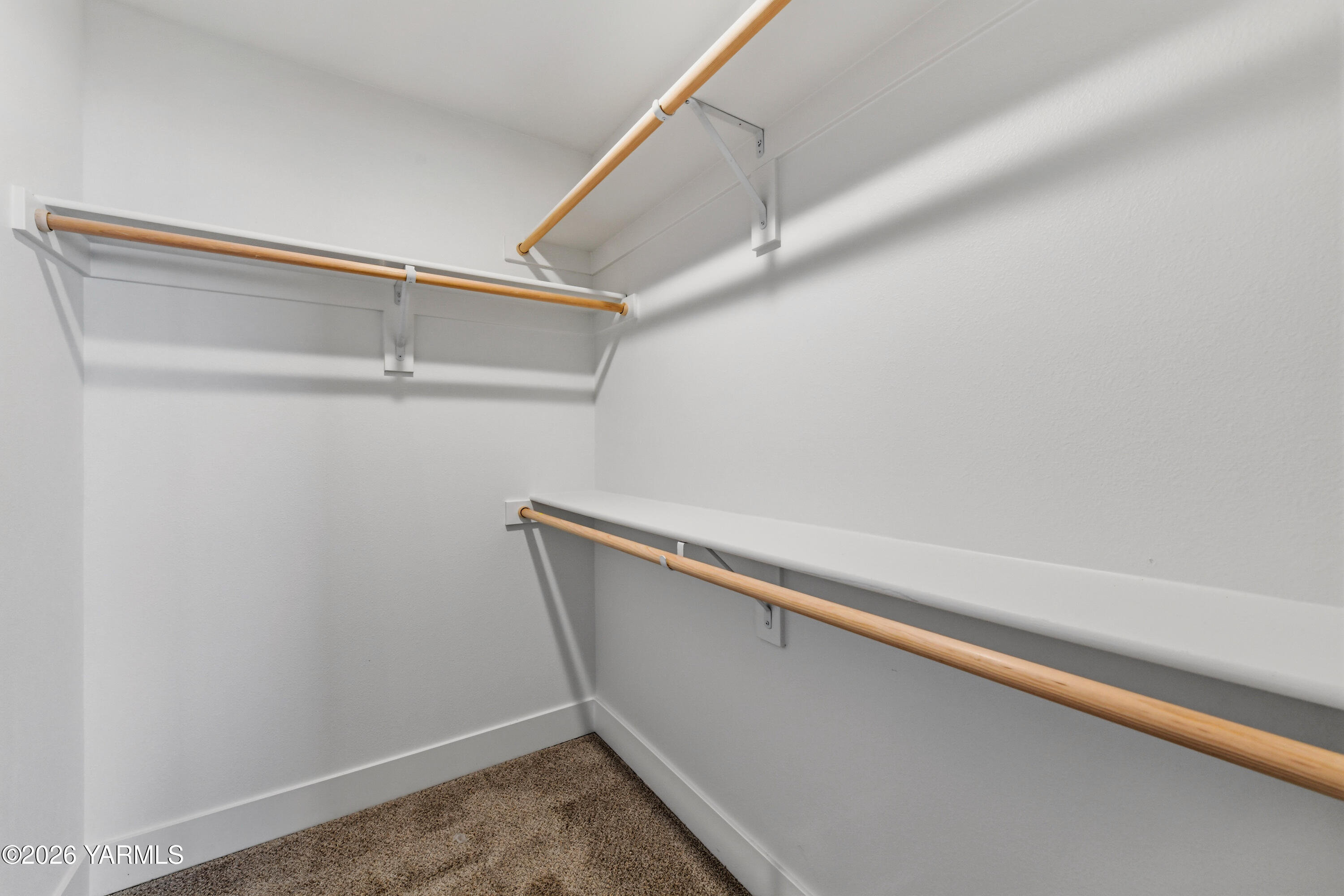 606 Grapevine Street, Unit PHASE 3 LOT 8) SPEC Grandview, WA 98930 - Photo 20 of 28 a view of a room with racks on the wall