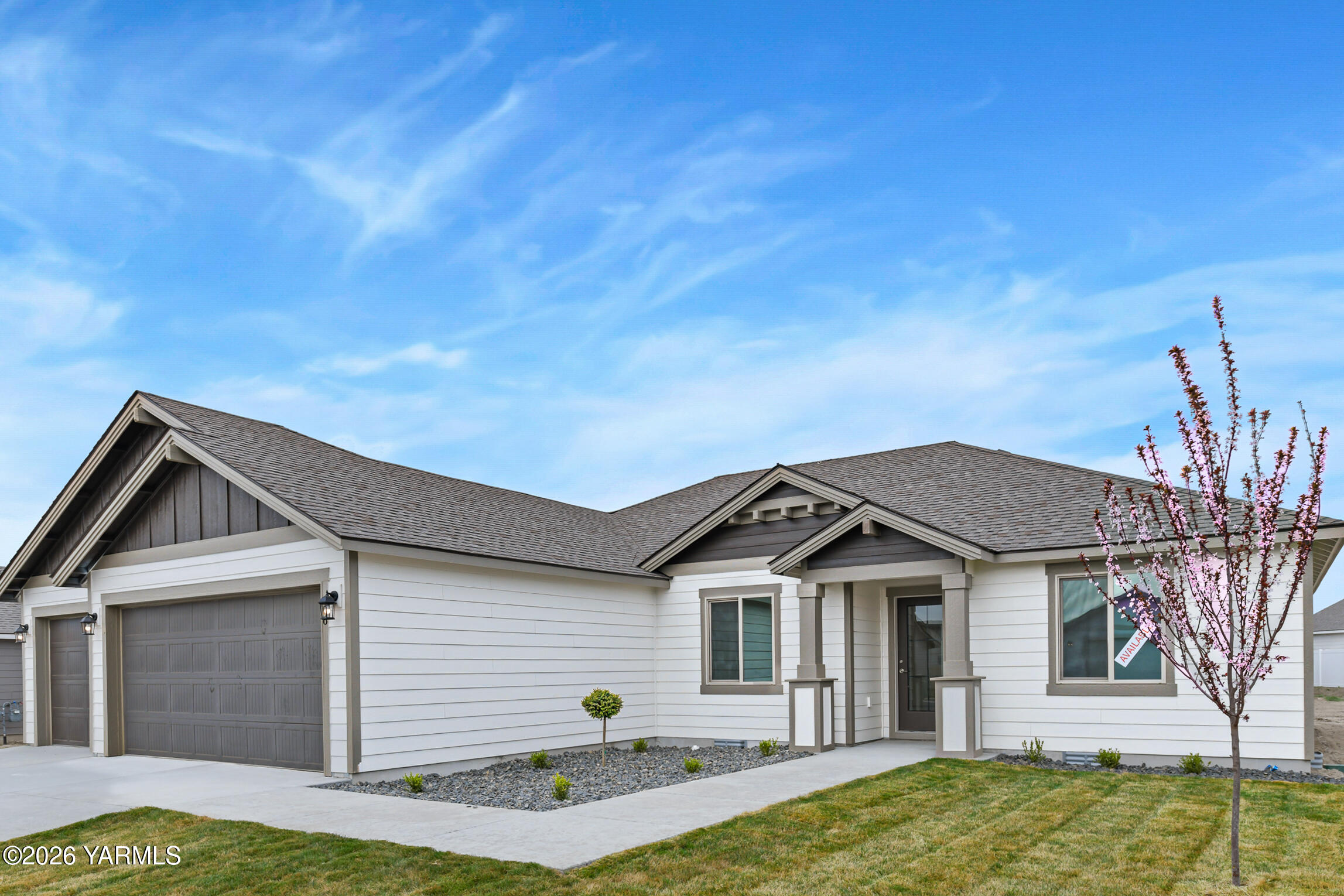 606 Grapevine Street, Unit PHASE 3 LOT 8) SPEC Grandview, WA 98930 - Photo 2 of 28 a view of a house with a yard