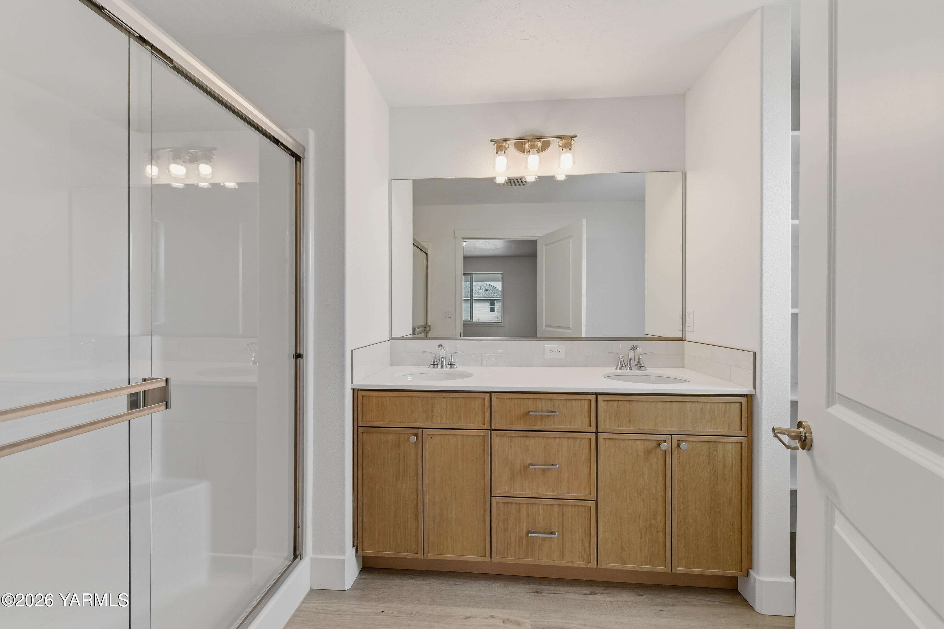 606 Grapevine Street, Unit PHASE 3 LOT 8) SPEC Grandview, WA 98930 - Photo 22 of 28 a bathroom with a double vanity sink and a mirror